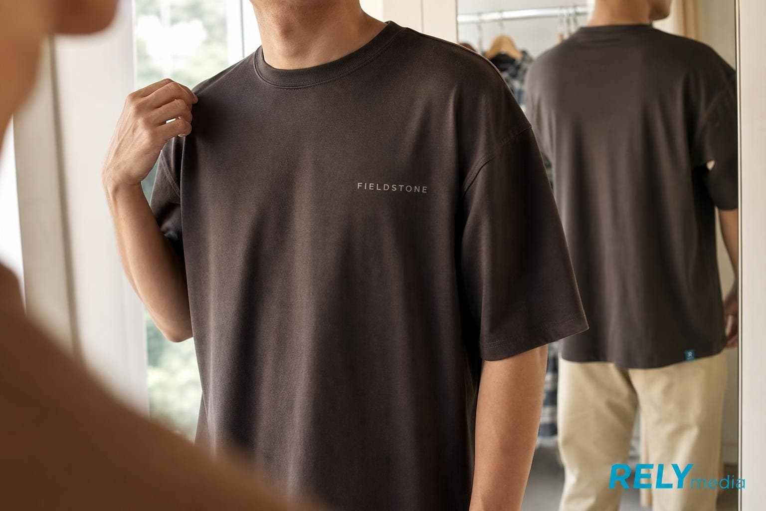 Checking how a Comfort Colors shirt fits in the mirror