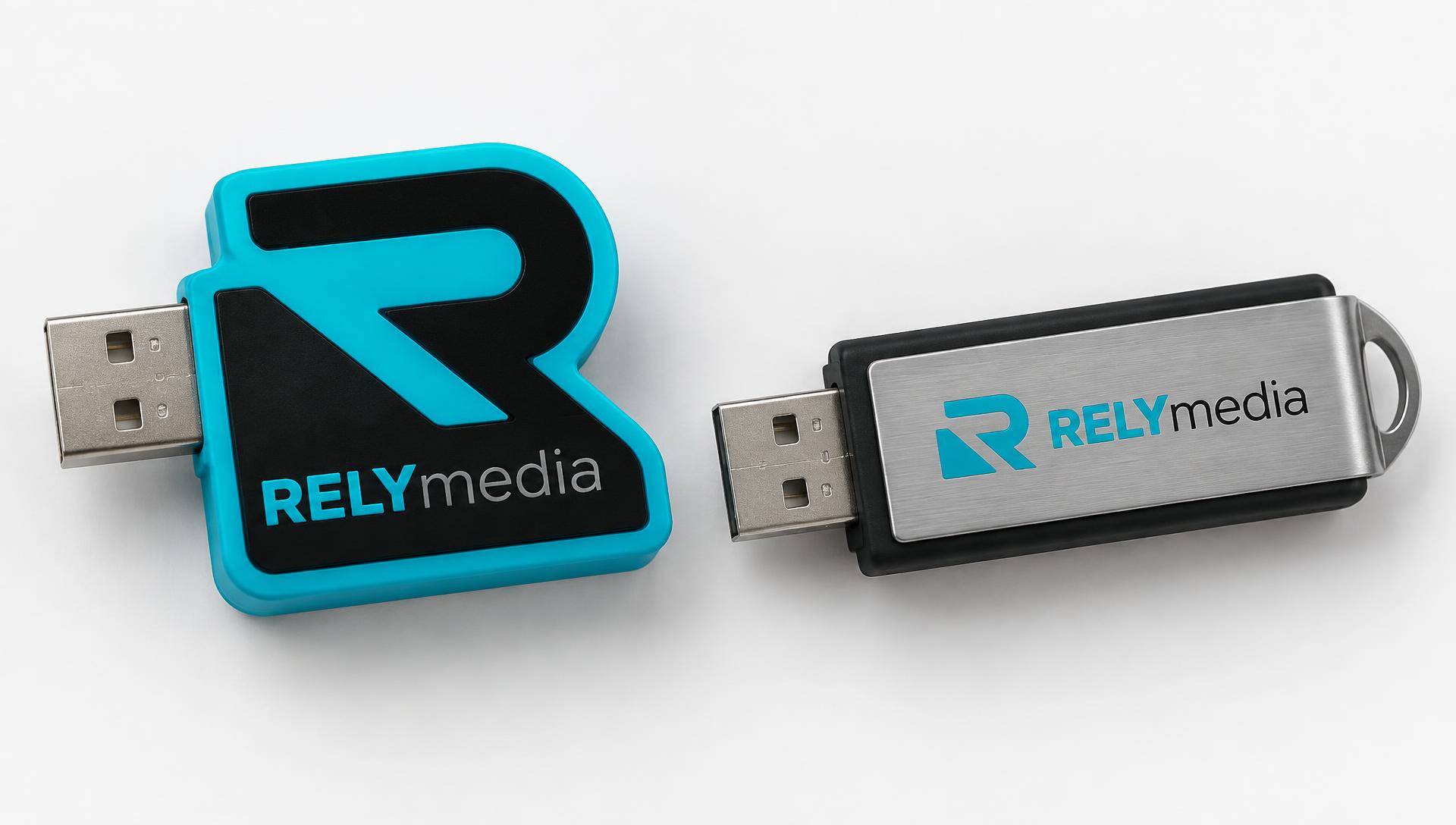 Custom molded RELYmedia flash drive next to a standard drive